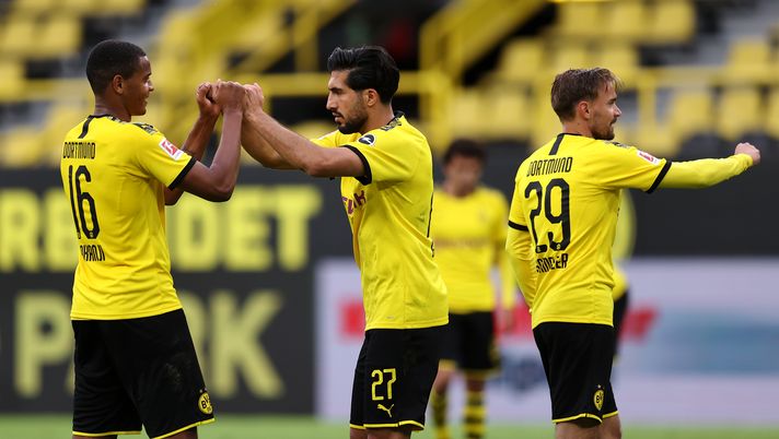DORTMUND, GERMANY - JUNE 06: Emre Can, Manuel Akanji and Marcel Schmelzer of Borussia Dortmund celebrate after victory in the Bundesliga match between Borussia Dortmund and Hertha BSC at Signal Iduna Park on June 06, 2020 in Dortmund, Germany. (Photo by Lars Baron/Getty Images)  Champions League