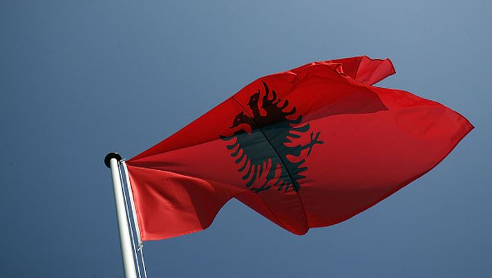 STRASBOURG, FRANCE - APRIL 02: The ensign of Albania waves in the wind on April 2, 2009 in Strasbourg, France. Croatia and Albania are the 27th and 28th new members of the alliance. The NATO's 60th anniversary summit will take place in Strasbourg, France, Baden-Baden and Kehl, Germany from April 3-4. (Photo by Carsten Koall/Getty Images) Albania Tare