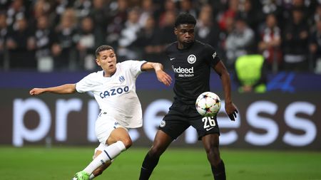 FRANKFURT AM MAIN, GERMANY - OCTOBER 26: Amine Harit of Olympique Marseille is challenged by Junior Dina Ebimbe of Eintracht Frankfurt during the UEFA Champions League group D match between Eintracht Frankfurt and Olympique Marseille at Deutsche Bank Park on October 26, 2022 in Frankfurt am Main, Germany. (Photo by Alex Grimm/Getty Images)