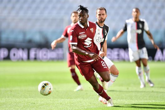 TURIN, ITALY - JULY 04: Soualiho Meite of Torino FC in action against Miralem Pjanic of Juventus during the Serie A match between Juventus and Torino FC at Allianz Stadium on July 4, 2020 in Turin, Italy. (Photo by Valerio Pennicino/Getty Images)