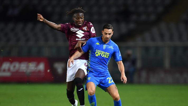 TURIN, ITALY - SEPTEMBER 24: Alieu Eybi Njie of Torino (left) battles for possession with Mattia De Sciglio of Empoli during the Coppa Italia match between Torino FC and Empoli FC at Olimpico Stadium on September 24, 2024 in Turin, Italy. (Photo by Valerio Pennicino/Getty Images) Torino-Empoli 1-2, il tabellino: sono tre gli ammoniti tra le fila dei granata - immagine 1