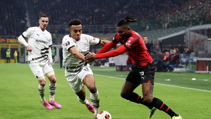 MILAN, ITALY - FEBRUARY 15: Rafael Leao of AC Milan battles for possession with Guela Doue of Stade Rennais during the UEFA Europa League 2023/24 Knockout Round Play-offs First Leg match between AC Milan and Stade Rennais FC at Stadio Giuseppe Meazza on February 15, 2024 in Milan, Italy. (Photo by Marco Luzzani/Getty Images) Doué