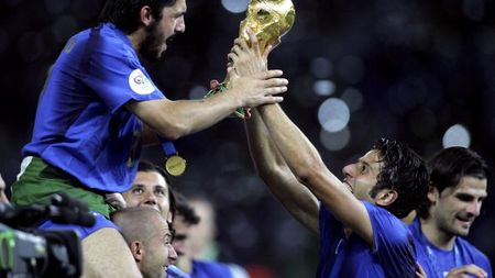 BERLIN - JULY 09: Gennaro Gattuso (L) and Fabio Grosso (R) of Italy celebrate with the world cup trophy during the FIFA World Cup Germany 2006 Final match between Italy and France at the Olympic Stadium on July 9, 2006 in Berlin, Germany.
(Photo by Ben Radford/Getty Images)
