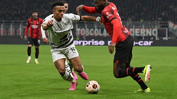 MILAN, ITALY - FEBRUARY 15: Rafael Leao of AC Milan dribbles against Guéla Doué of Stade Rennais FC during the UEFA Europa League 2023/24 Knockout Round Play-offs First Leg match between AC Milan and Stade Rennais FC at Stadio Giuseppe Meazza on February 15, 2024 in Milan, Italy. (Photo by Claudio Villa/AC Milan via Getty Images) Guéla Doué