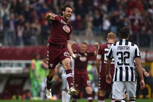 TURIN, ITALY - APRIL 26: Emiliano Moretti of Torino FC celebrates victory at the end of the Serie A match between Torino FC and Juventus FC at Stadio Olimpico di Torino on April 26, 2015 in Turin, Italy. (Photo by Valerio Pennicino/Getty Images)