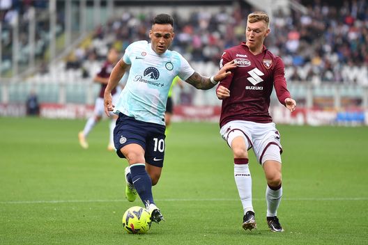 TURIN, ITALY - JUNE 03: Perr Schuurs of Torino FC competes with Lautaro Martinez of FC Internazionale during the Serie A match between Torino FC and FC Internazionale at Stadio Olimpico di Torino on June 3, 2023 in Turin, Italy. (Photo by Valerio Pennicino/Getty Images)