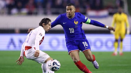 France's forward #10 Kylian Mbappe (R) fights for the ball with Croatia's midfielder #10 Luka Modric during the UEFA Nations League quarter-final first-leg football match between Croatia and France at the Poljud Stadium in Split, on March 20, 2025. (Photo by FRANCK FIFE / AFP) (Photo by FRANCK FIFE/AFP via Getty Images)