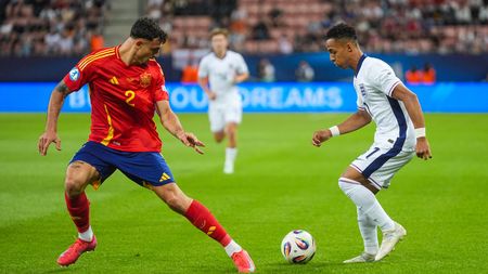 TRNAVA, SLOVAKIA - JUNE 21: Marc Pubill of U21 Spain in action against Omari Hutchinson of U21 England during the UEFA European Under-21 Championship 2025 Quarter-Final match between Spain and England at A. Malatinsky Stadium on June 21, 2025 in Trnava, Slovakia. (Photo by Christian Hofer/Getty Images)