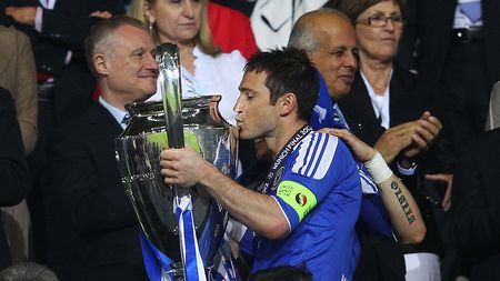 MUNICH, GERMANY - MAY 19: Frank Lampard of Chelsea celebrates with the trophy after their victory in the UEFA Champions League Final between FC Bayern Muenchen and Chelsea at the Fussball Arena München on May 19, 2012 in Munich, Germany. (Photo by Alex Livesey/Getty Images)