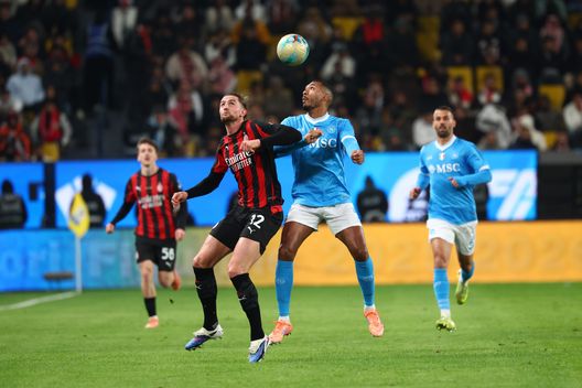 RIYADH, SAUDI ARABIA - DECEMBER 18: Adrien Rabiot of AC Milan jumps for the ball against Juan Jesus of SSC Napoli during the Supercoppa Italiana semifinal match between SSC Napoli and AC Milan at King Saud University Stadium on December 18, 2025 in Riyadh, Saudi Arabia. (Photo by Giuseppe Cottini/AC Milan via Getty Images)