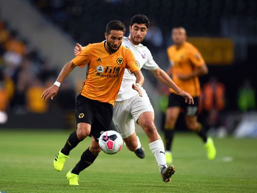 WOLVERHAMPTON, ENGLAND - AUGUST 15: Joao Moutinho of Wolverhampton Wanderers is tackled by Erik Vardanyan of FC Pyunik during the UEFA Europa League Third Qualifying Round Second Leg between Wolverhampton Wanderers and FC Pyunik at Molineux on August 15, 2019 in Wolverhampton, England. (Photo by Shaun Botterill/Getty Images)