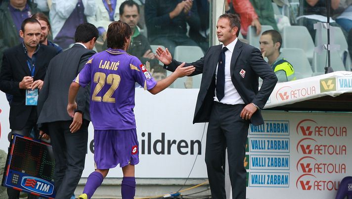 FLORENCE, ITALY - SEPTEMBER 26: Sinisa Mihajlovic (R) the coach of ACF Fiorentina celebrates his player Adem Ljajic during the Serie A match between Fiorentina and Parma at Stadio Artemio Franchi on September 26, 2010 in Florence, Italy. (Photo by Paolo Bruno/Getty Images)