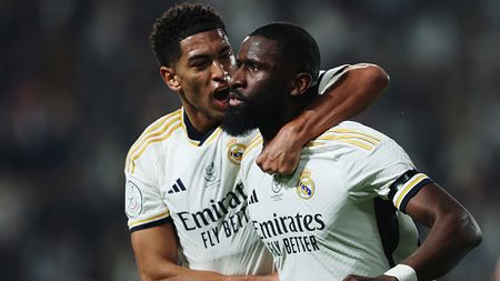 RIYADH, SAUDI ARABIA - JANUARY 10: Antonio Ruediger of Real Madrid (R) celebrates scoring his team's first goal with teammate Jude Bellingham during the Super Copa de Espana semi-final match between Real Madrid CF and Atletico Madrid at Al-Awwal Park on January 10, 2024 in Riyadh, Saudi Arabia. (Photo by Yasser Bakhsh/Getty Images)