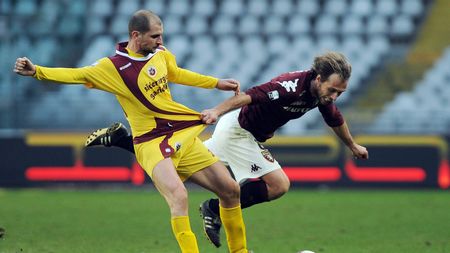 TURIN, ITALY - JANUARY 22: Daniele Dalla Bona of AS Cittadella is pulled by his shirt by Alessandro Budel of Torino FC during the Serie B match between Torino FC and AS Cittadella at Olimpico Stadium on January 22, 2011 in Turin, Italy. (Photo by Valerio Pennicino/Getty Images)
