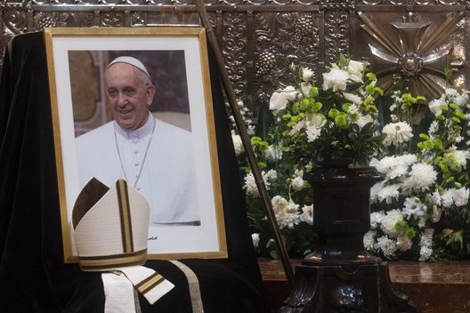 BUENOS AIRES, ARGENTINA - APRIL 21: A picture of Pope Francis along with the hat he used while acting as Bishop of Buenos Aires is displayed after his death at Buenos Aires Cathedral on April 21, 2025 in Buenos Aires, Argentina. Pope Francis, Head of the Catholic Church for 13 years, died at 88. Born Jorge Mario Bergoglio in Argentina, he was the first pope from the Society of Jesus and the first from the Americas. Before his papacy, he served as Archbishop of Buenos Aires and was later appointed cardinal. (Photo by Sebastian Rodeiro/Getty Images) Papa Francesco