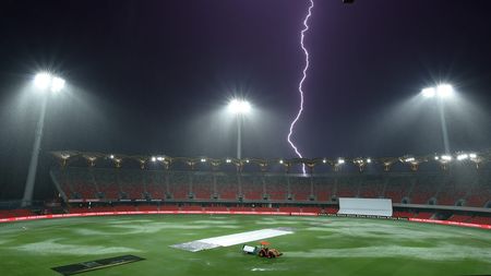 GOLD COAST, AUSTRALIA - OCTOBER 01: Lightning is seen during a rain delay on day two of the Women's International Test match between Australia and India at Metricon Stadium on October 01, 2021 in Gold Coast, Australia. (Photo by Matt Roberts/Getty Images)