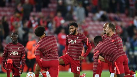 LIVERPOOL, ENGLAND - SEPTEMBER 15: Joe Gomez of Liverpool warms up prior to the UEFA Champions League group B match between Liverpool FC and AC Milan at Anfield on September 15, 2021 in Liverpool, England. (Photo by Shaun Botterill/Getty Images) Joe Gomez Milan