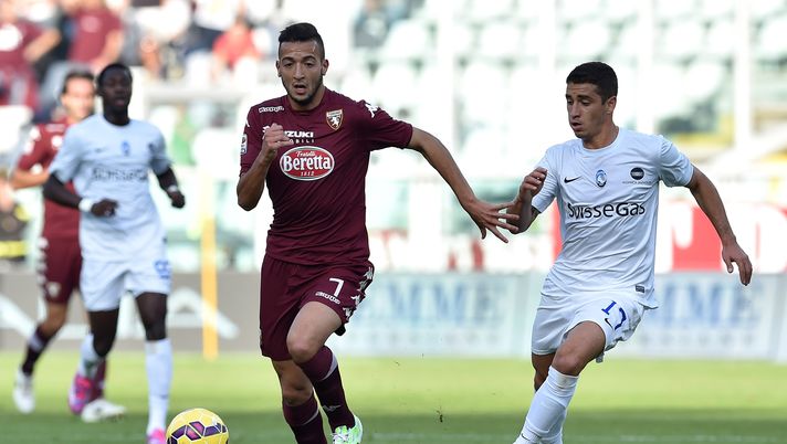 TURIN, ITALY - NOVEMBER 02: Omar El Kaddouri (L) of Torino FC is challenged by Carlos Carmona of Atalanta BC during the Serie A match between Torino FC and Atalanta BC at Stadio Olimpico on November 2, 2014 in Turin, Italy. (Photo by Valerio Pennicino/Getty Images) Omar El Kaddouri compie 35 anni: tanti auguri all’ex giocatore granata - immagine 1