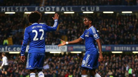LONDON, ENGLAND - DECEMBER 29: Samuel Eto'o (R) of Chelsea celebrates with teammate Willian after scoring his team's second goal during the Barclays Premier League match between Chelsea and Liverpool at Stamford Bridge on December 29, 2013 in London, England. (Photo by Julian Finney/Getty Images)