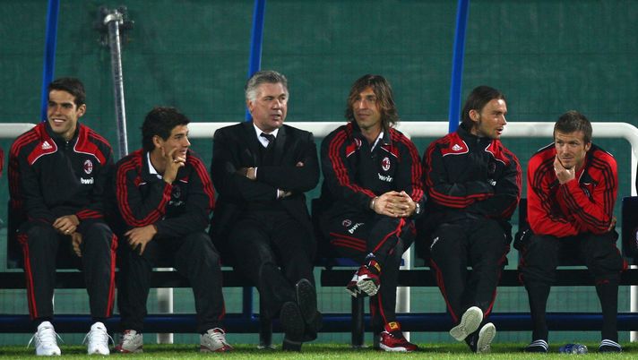 DUBAI, UNITED ARAB EMIRATES - JANUARY 06: (L to R) Kaka, Alexandre Pato, head coach Carlo Ancelotti, Andrea Pirlo, Marek Jankulowski and David Beckham of AC Milan watch the penalty shootout form the bench after the Dubai Football Challenge match between AC Milan and Hamburger SV at The Emirates Sevens Stadium on January 6, 2009 in Dubai, United Arab Emirates. (Photo by Ryan Pierse/Getty Images)
