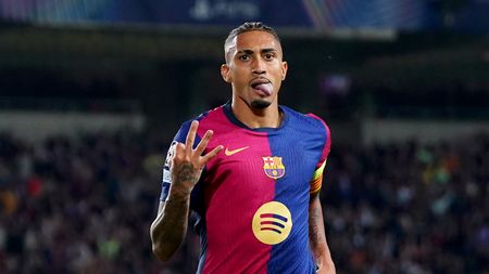 BARCELONA, SPAIN - OCTOBER 23: Raphinha of FC Barcelona celebrates scoring his team's fourth goal and his hat-trick goal during the UEFA Champions League 2024/25 League Phase MD3 match between FC Barcelona and FC Bayern Munchen at Estadi Olimpic Lluis Companys on October 23, 2024 in Barcelona, Spain. (Photo by Pedro Salado/Getty Images)