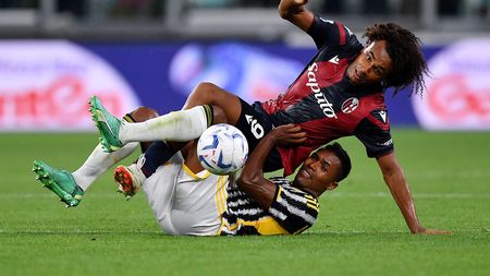 TURIN, ITALY - AUGUST 27: Alex Sandro of Juventus clashes with Joshua Zirkzee of Bologna during the Serie A TIM match between Juventus and Bologna FC at Allianz Stadium on August 27, 2023 in Turin, Italy. (Photo by Valerio Pennicino/Getty Images)
