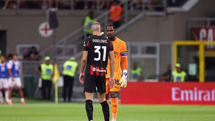 MILAN, ITALY - AUGUST 17: Mike Maignan of AC Milan speaks with Strahinja Pavlovic during the Coppa Italia match between AC Milan and SSC Bari at Stadio San Siro on August 17, 2025 in Milan, Italy. (Photo by Giuseppe Cottini/AC Milan via Getty Images) Milan