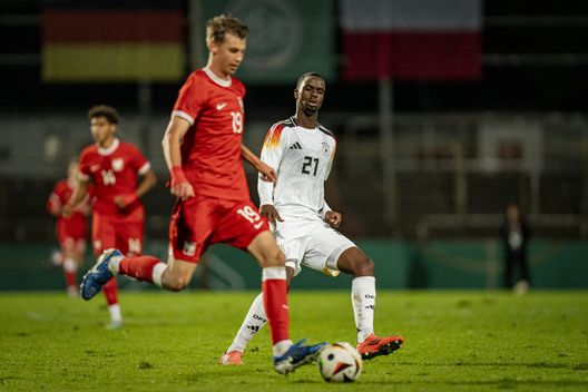 AHLEN, GERMANY - OCTOBER 11: Jan Ziolkowski of U20 Poland is challenged by Ilyas Ansah of U20 Germany during the International Friendly match between U20 Germany and U20 Poland at Wersestadion on October 11, 2024 in Ahlen, Germany. (Photo by Fabio Deinert/Getty Images for DFB)