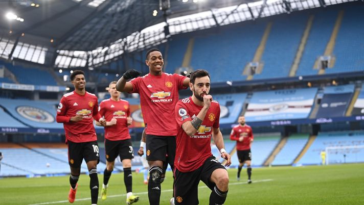 MANCHESTER, ENGLAND - MARCH 07: Bruno Fernandes of Manchester United celebrates scoring the first goal from a penalty during the Premier League match between Manchester City and Manchester United at Etihad Stadium on March 07, 2021 in Manchester, England. Sporting stadiums around the UK remain under strict restrictions due to the Coronavirus Pandemic as Government social distancing laws prohibit fans inside venues resulting in games being played behind closed doors. (Photo by Laurence Griffiths/Getty Images) Wigan-Manchester United