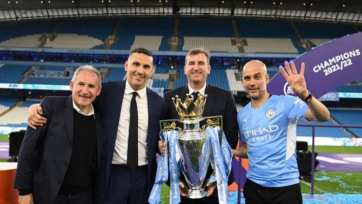 MANCHESTER, ENGLAND - MAY 22: Txiki Begiristain, Khaldoon Al Mubarak, Ferran Soriano and Pep Guardiola, Manager of Manchester City celebrate with the Premier League trophy after their side finished the season as Premier League champions during the Premier League match between Manchester City and Aston Villa at Etihad Stadium on May 22, 2022 in Manchester, England. (Photo by Michael Regan/Getty Images) Manchester City