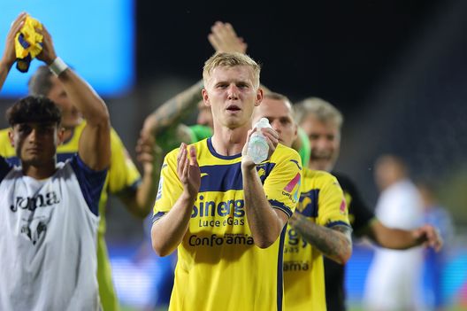 EMPOLI, ITALY - AUGUST 19: Josh Doig of Hellas Verona FC celebrates the victory after the Serie A TIM match between Empoli FC and Hellas Verona FC at Stadio Carlo Castellani on August 19, 2023 in Empoli, Italy. (Photo by Gabriele Maltinti/Getty Images)