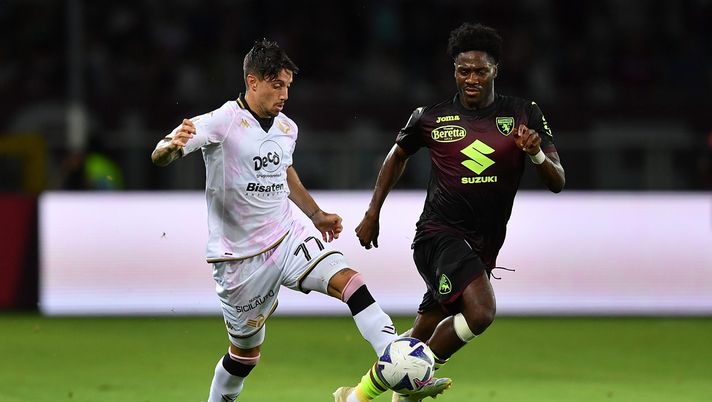 TURIN, ITALY - AUGUST 06: Salvatore Elia of Palermo calcio in action against Ola Aina of Torino FC during the Coppa Italia match between Torino FC and Palermo at Olimpico Stadium on August 6, 2022 in Turin, Italy. (Photo by Valerio Pennicino/Getty Images) Spezia
