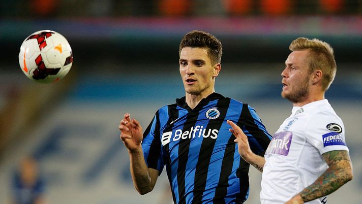 BRUGGE, BELGIUM - APRIL 16: Thomas Meunier of Club Brugge and Brian Hamalainen of Racing Genk battle for the ball during the Jupiler League match between Club Brugge v Racing Genk at the Jan Breydel Stadium on April 16, 2014 in Brugge, Belgium. (Photo by Dean Mouhtaropoulos/Getty Images) Club Bruges Genk