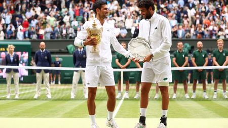 LONDON, ENGLAND - JULY 11: Novak Djokovic of Serbia poses with the winners trophy after winning his men's Singles Final match against Matteo Berrettini of Italy who poses with the runners up trophy on Day Thirteen of The Championships - Wimbledon 2021 at All England Lawn Tennis and Croquet Club on July 11, 2021 in London, England. (Photo by Julian Finney/Getty Images)