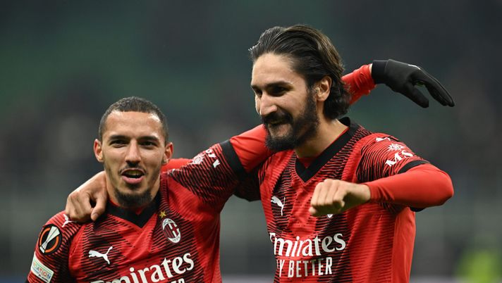 MILAN, ITALY - FEBRUARY 15: Yacine Adli of AC Milan celebrates the win with Ismael Bennacer at the end of the UEFA Europa League 2023/24 Knockout Round Play-offs First Leg match between AC Milan and Stade Rennais FC at Stadio Giuseppe Meazza on February 15, 2024 in Milan, Italy. (Photo by Claudio Villa/AC Milan via Getty Images) Yacine Adli, Ismael Bennacer - Milan
